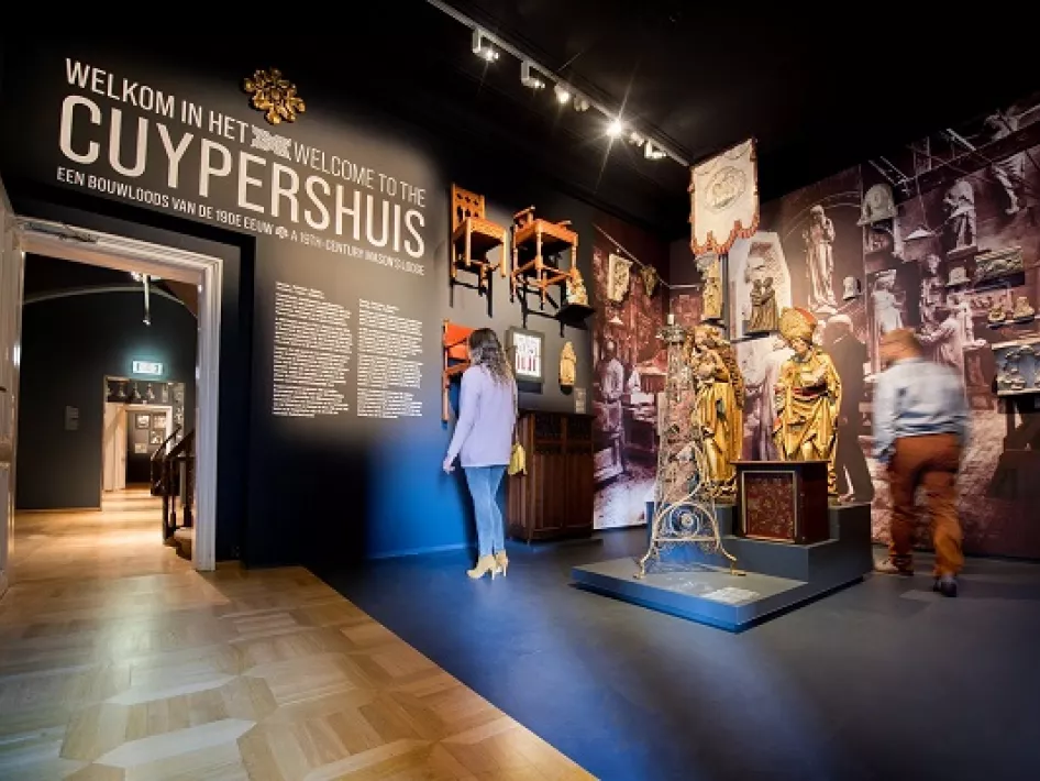 Woman looks at the information boards in the exhibition area