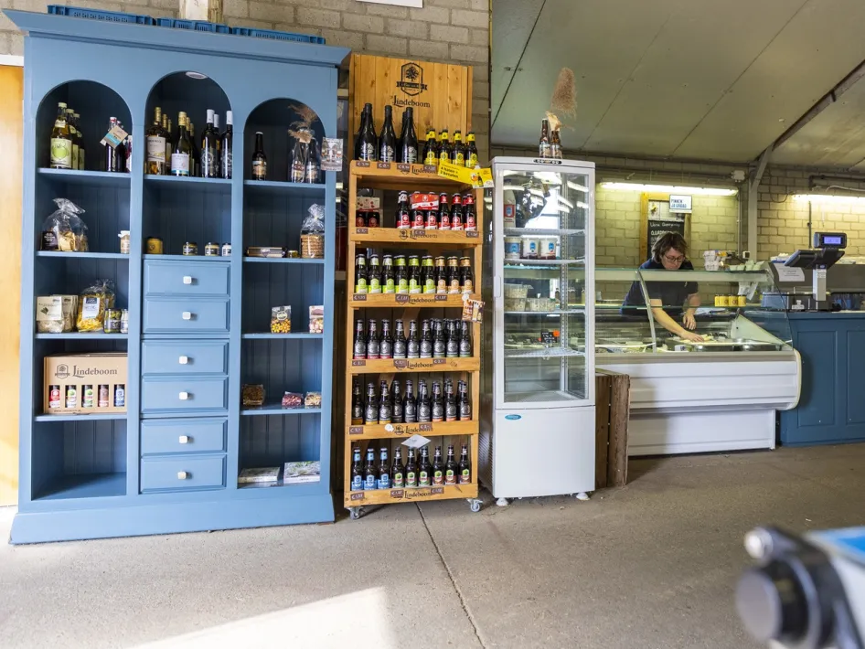 Farm shop with shelves full of regional products and a counter where asparagus is sold at Asparagus farm Oppe Haes
