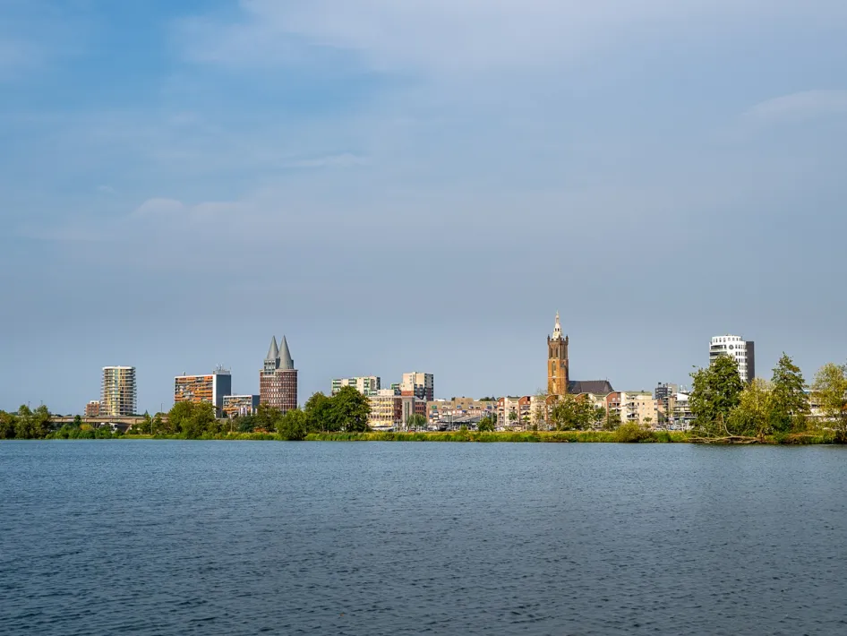 View across the water towards the Roermond skyline along the International Meuse Cycle Route.
