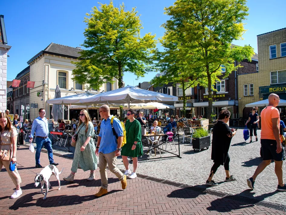 Square full of people with a full terrace on a beautiful summer day in Weert