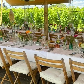 A long table is set for the culinary experience Among the Vines at Thorn Winery.